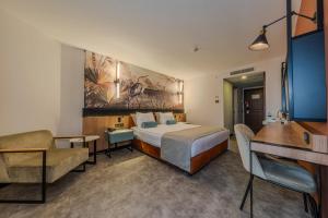 Кровать или кровати в номере Best Western Plus Khan Hotel