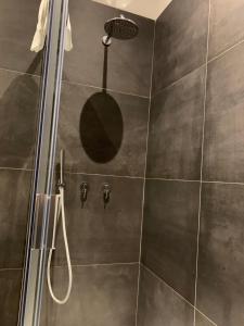 a bathroom with a shower with a glass door at Spazio SIMA Space 2 - 1 in Milan
