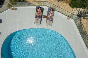 Πισίνα στο ή κοντά στο Seaview Villa Ormos, Heated Pool, Sea & Sun Villas