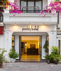 a facade of aapology hotel with a sign on it at Paddy Hotel in Ha Long