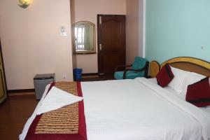 Una cama o camas en una habitación de Hotel Mudkhu Durbar