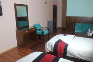 Una cama o camas en una habitación de Hotel Mudkhu Durbar