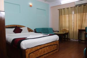 Una cama o camas en una habitación de Hotel Mudkhu Durbar