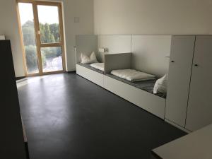 מיטה או מיטות בחדר ב-Jugendherberge Heilbronn