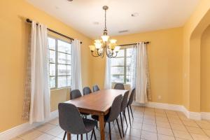 a dining room with a wooden table and chairs at Milpitas 4br w garage nr mall dining SFO-1593 in Milpitas +14 photos