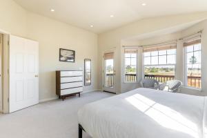 a bedroom with a bed and a dresser and windows at Newark 4br w backyard patio ac garage SFO-1586 in Newark