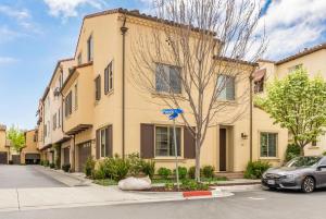 a building with a car parked in front of it at Milpitas 4br w garage nr mall dining SFO-1593 in Milpitas