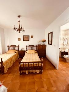 Postel nebo postele na pokoji v ubytování Vivienda Familiar en el Centro de Baeza + 16 fotografií