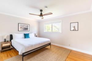 a bedroom with a bed and a ceiling fan at Los Gatos 5br w backyard nr trails wineries SFO-1614 in Los Gatos