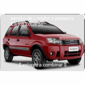 ein rotes Suzuki-vitara-Fahrzeug mit den Worten, die Semota übersetzt. in der Unterkunft Suíte o Pescador, praia do rosa in Garopaba