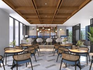 uma representação de um restaurante com mesas e cadeiras em ASTON Palu Hotel & Conference Center em Palu
