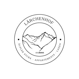 un logo circolare con una catena montuosa sullo sfondo di Älpler Stuba Appartements am Lärchenhof a Warth am Arlberg