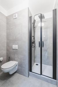 a bathroom with a shower and a toilet in it at BP Hostel / Urbinská 144 in Český Krumlov