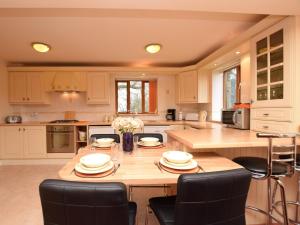 a kitchen with a large wooden table with chairs at 2 bed in Barlow PK612 in Barlow