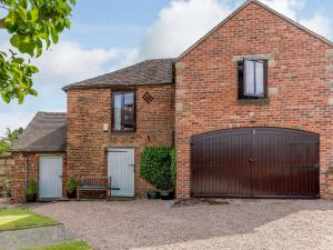 a brick house with a garage at 2 bed in Brailsford PK816 in Brailsford