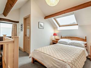 a bedroom with a bed and a skylight at 1 Bed in Wirksworth PK925 in Wirksworth