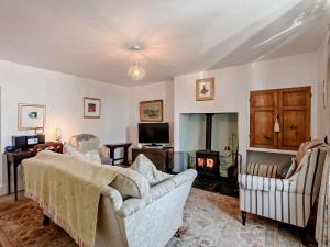 a living room with a couch and a fireplace at 2 bed in Frosterley 54143 in Frosterley