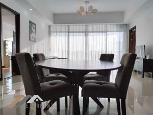 a dining room with a table and chairs at Bay Resort by Evernent in Miri