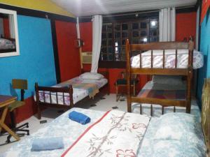 Ένα ή περισσότερα κρεβάτια σε δωμάτιο στο Pousada Center Lux