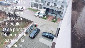 an aerial view of a parking lot with cars parked at Apartament Dem Radulescu 3 camere! in Râmnicu Vâlcea