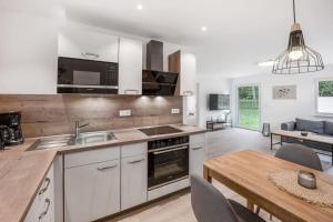 Nhà bếp/bếp nhỏ tại Ferienhaus Dünenwald
