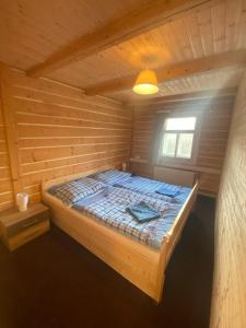 Llit o llits en una habitació de Penzion Lesní Zátiší- Harrachov