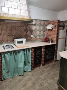 Een keuken of kitchenette bij Dhara Apartamento Estudio