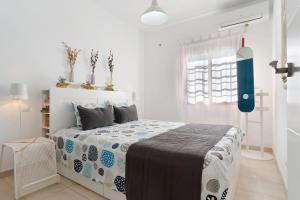 Postel nebo postele na pokoji v ubytování Bungalow Aloe Dunas 2