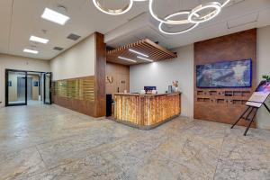an office with a lobby with a reception counter at Deo Plaza Basen & Sauna by Grand Apartments in Gdańsk