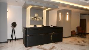 a dressing room with a black counter and a mirror at DAYMONTH HOTEL in Istanbul