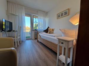 Postel nebo postele na pokoji v ubytování Apart Hotel Freiburg