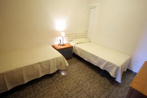 Posteľ alebo postele v izbe v ubytovaní Near Maresme Forum Apartment