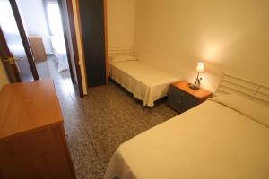 Posteľ alebo postele v izbe v ubytovaní Near Maresme Forum Apartment