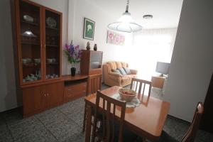 a living room with a table and chairs and a couch at Near Maresme Forum Apartment in Barcelona