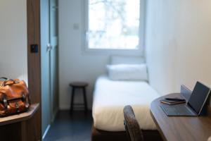 Postel nebo postele na pokoji v ubytování Kyriad Nancy Sud - Ludres
