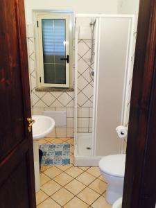 a bathroom with a sink and a toilet at Residence Pantaleo in Ricadi +46 photos