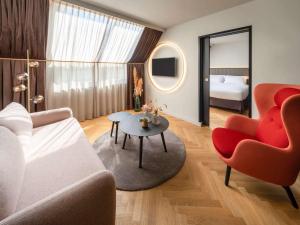Postel nebo postele na pokoji v ubytování Hotel Am Konzerthaus - MGallery Collection