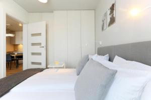 Posteľ alebo postele v izbe v ubytovaní Apartamenty Jozefina
