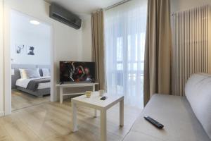 Posteľ alebo postele v izbe v ubytovaní Apartamenty Jozefina