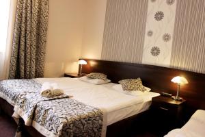 Posteľ alebo postele v izbe v ubytovaní Hotel Monet & Rubbens