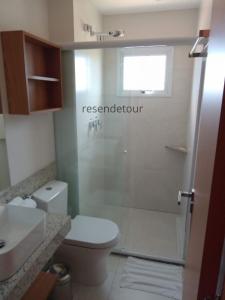 a bathroom with a shower with a toilet and a sink at Salinas Exclusive Resort in Salinópolis