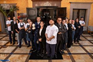 a group of people posing for a picture in a room at Europe Villa Cortes GL in Playa de las Americas