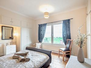 a bedroom with a bed and a window at 3 Bed in Lowestoft 75154 in Lowestoft