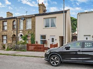a black car parked in front of a house at 3 Bed in Lowestoft 75154 in Lowestoft
