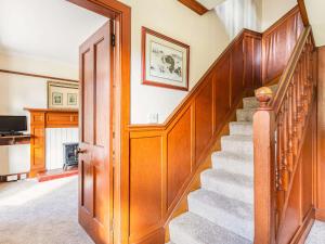 a staircase in a home with wood paneling at 4 Bed in Kinlochewe CA179 in Kinlochewe