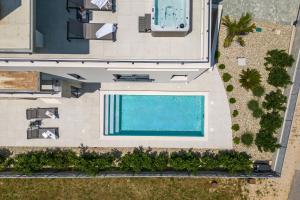 an overhead view of a swimming pool at a resort at Villa Nadja ZadarVillas in Bibinje