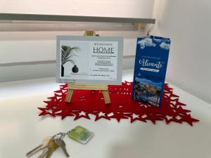 a star christmas home on a table with a pair of scissors at Moderna habitación en el corazón de Alicante in Alicante