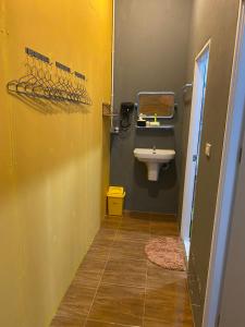 a bathroom with a sink and a toilet at The view Hostel in Phi Phi Islands