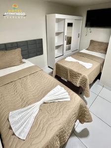 Säng eller sängar i ett rum på Hotel Aconchego Cearense