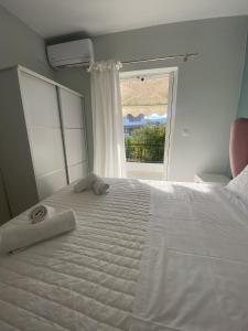 Ένα ή περισσότερα κρεβάτια σε δωμάτιο στο Luxury Apartment In Nafplio